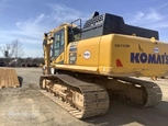 Used Excavator under blue sky